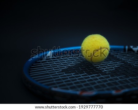 Sport and healthy lifestyle. Tennis. Yellow ball for tennis and a racket on table. Sports background with tennis concept, photo