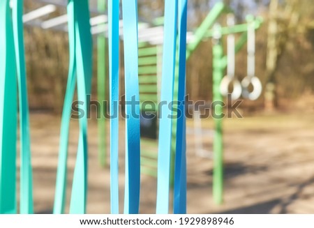 Close up picture of resistance bands at outdoor gym, selective focus.