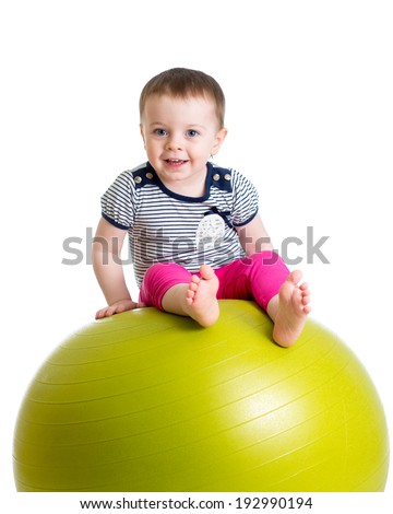 kid girl doing fitness exercise with fitness ball