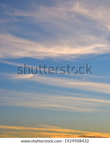 Background image of deep blue sky with  white ,orange clouds .