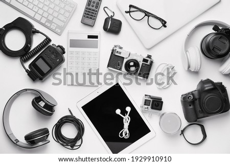 Different modern devices on white background Royalty-Free Stock Photo #1929910910