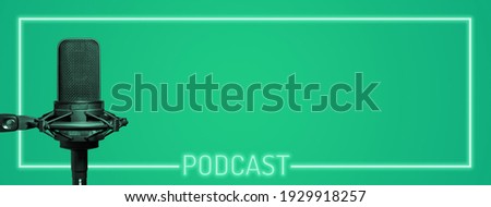Podcast frame and microphone on green background with copy space, podcasting banner for broadcast production and website header Royalty-Free Stock Photo #1929918257