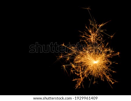 A picture of a real sparkler set against a black background