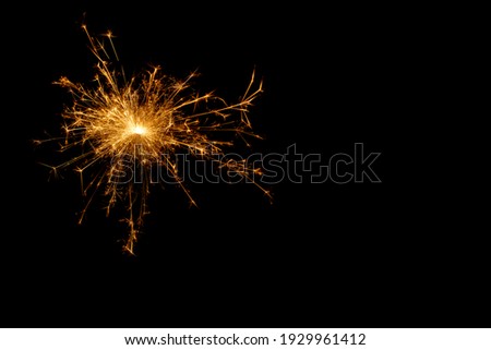 A picture of a real sparkler set against a black background