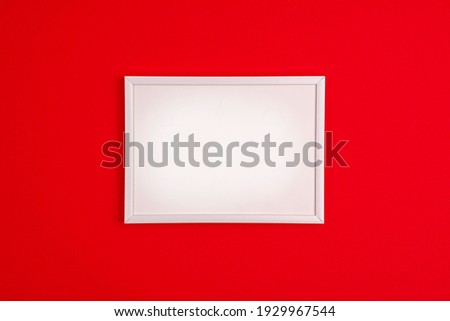 Mockup white frame flat lay on vibrant red background. Mothers day holiday presents happy birthday concept with space for your text template.