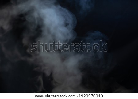 Blurred white smoke and black background. soft picture