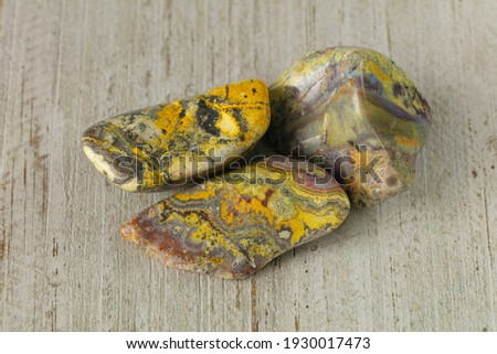 picture jasper nature textured yellow and violet stone on black surface
