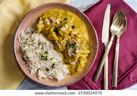 Authentic Indian chicken korma curry with jasmine rice Royalty-Free Stock Photo #1930024970