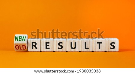 New vs old results symbol. Turned the wooden cube and changed words 'old results' to 'new results'. Beautiful orange background. Business, new or old results concept. Copy space.