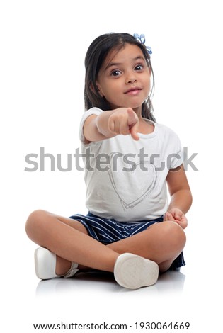 Studio Portrait of Beauty Girl Pointing at The Camera, Isolated on White Background
