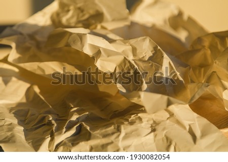 Crumpled paper in the morning sun. Light from the window. 7.30 am
