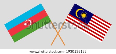 Crossed flags of Azerbaijan and Malaysia. Official colors. Correct proportion