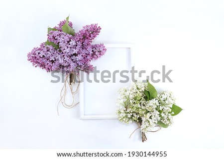 Abstract floral composition flat layout, background, minimal holiday concept, banner of spring. Creative modern bouquet with lilacs. Greeting card for mother's day, womens day, happy birthday,