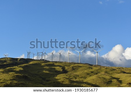 A closeup of mountain wind generators turbines on a mountainside of, Maui, Hawaii