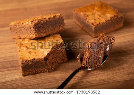 Pieces of chocolate brownie. Image with selective focus.
