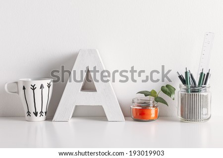 White coffee mug with arrows./ Diy office decoration on white background.  Royalty-Free Stock Photo #193019903