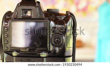 Close-ups and details of Digital cameras in black on a blurry background