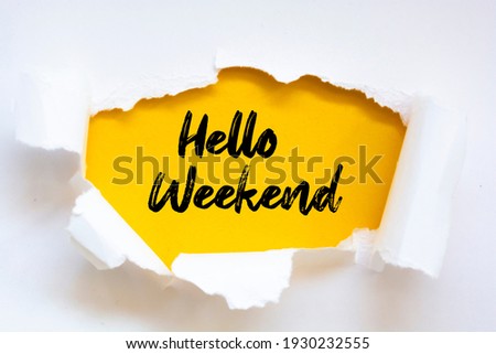 Hello Weekend on white torn paper Royalty-Free Stock Photo #1930232555