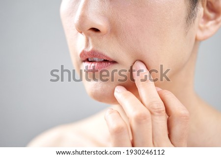 Middle-aged Japanese woman who cares about nasolabial fold Royalty-Free Stock Photo #1930246112