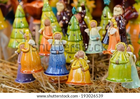 closeup picture on porcelain colorful angels decoration for Christmas celebration