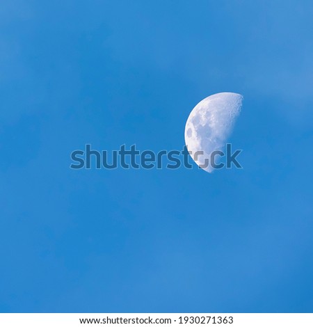 The moon with blue sky in day time square format. ( soft image)