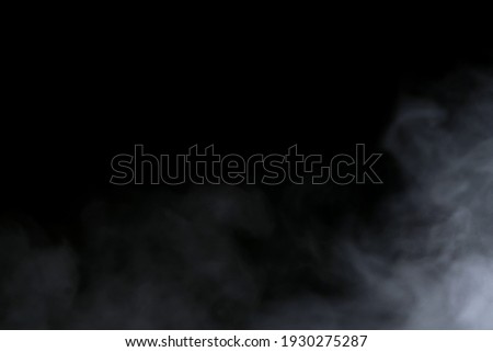 Close-up view of white water vapor with spray from the humidifier. Isolated on black background Royalty-Free Stock Photo #1930275287