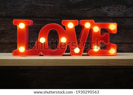 Pink Love LED Decorative on wooden background
