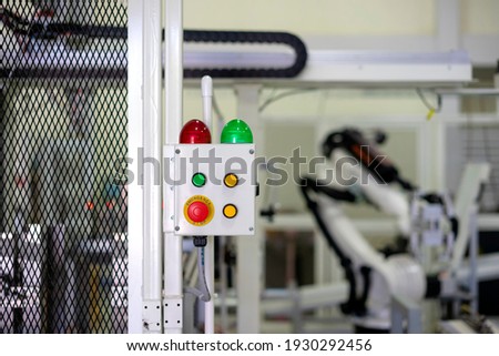 Factory 4.0 concept : View of operation panel on fence of manufacturing machine.