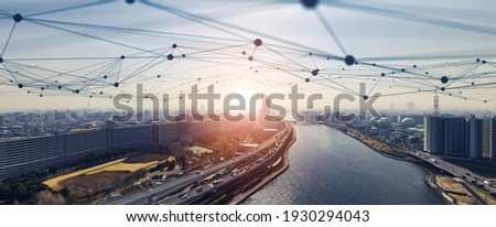 Modern cityscape and communication network concept. Telecommunication. IoT (Internet of Things). ICT (Information communication Technology). 5G. Smart city. Digital transformation. Royalty-Free Stock Photo #1930294043