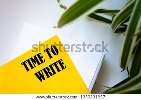 TIME TO WRITE , the phrase is written on colored stickers, on a notepad background. Business