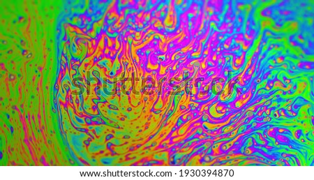 Rainbow colored abstract background in motion closeup