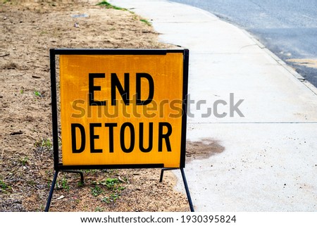 Yellow traffic end detour sign