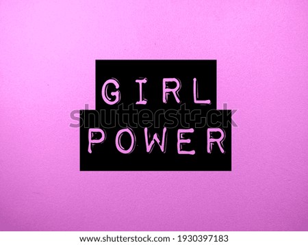 Selective focus.Word GIRL POWER on pink background.Positive saying for cards,motivational posters and smartphone wallpaper .