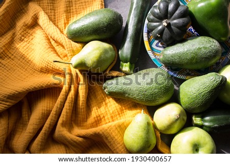Fresh vegetables and fruits on yellow kitchen towel. Top view photo. Healthy eating concept. 