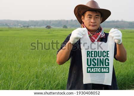 Handsome Asian man is holding plastic bag. Environmental concept.  Zero waste. Reuse , reduce, recycle. Go green. Stop global warming.