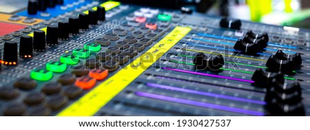 Close up of Sliders and buttons on Audio Mixing Desk at live event	 Royalty-Free Stock Photo #1930427537