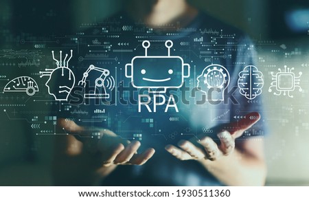 Robotic Process Automation RPA theme with young man in the night Royalty-Free Stock Photo #1930511360