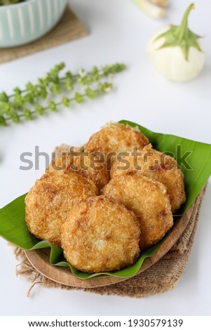 Perkedel kentang is a food made from potatoes that have been fried or boiled before being crushed, then mixed with minced meat, sliced ​​leeks and celery leaves and spices. Selective focus 