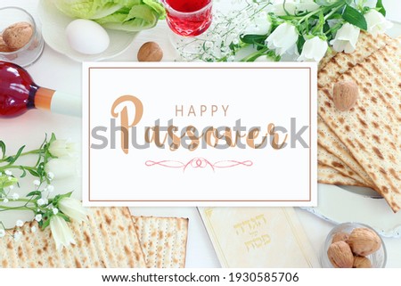 Pesah celebration concept (jewish Passover holiday). Traditional book with text in hebrew: Passover Haggadah (Passover Tale) Royalty-Free Stock Photo #1930585706