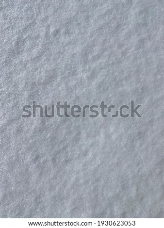 Snow background. Fresh texture of soft snow.