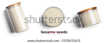 Sesame seeds in glass jar isolated on a white background. High quality photo