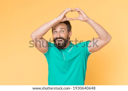 Healthy life. Mature man heart gesture. Heart and healthcare. Diagnostics and treatment. Preventing heart attack. Senior bearded man holding heart shape hands. Romantic sign. Happy smiling guy.
