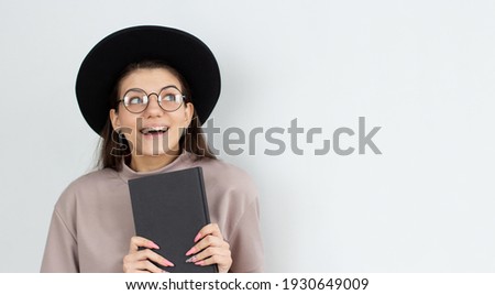 Copyspace photo of cute empty space student preparing for exams at university and self developing holding notebook with hands isolated over white color background