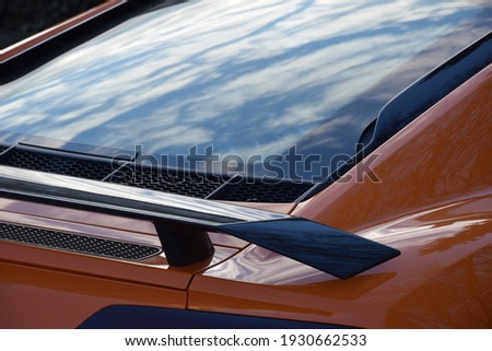 clouds reflection on sport car