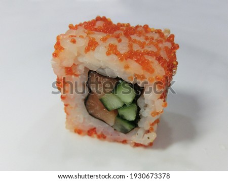 Rolls with salmon, caviar and cucumber
