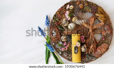 wiccan Altar for spring Ostara sabbat. wheel of the year with flowers and eggs. Esoteric Ritual for Ostara, pagan holiday. Magical Spring equinox. flat lay Royalty-Free Stock Photo #1930676441