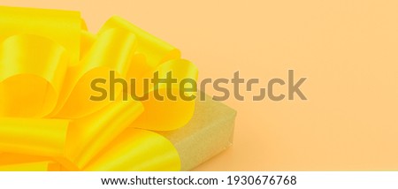 yellow bow on yellow background
