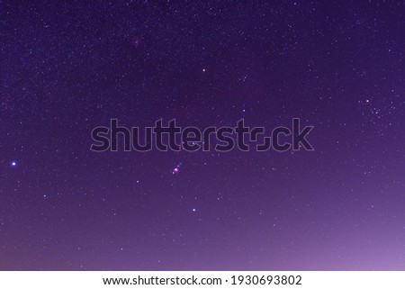 The night sky with Sirius star, Orion constellation and Aldebaran in Taurus constellation.