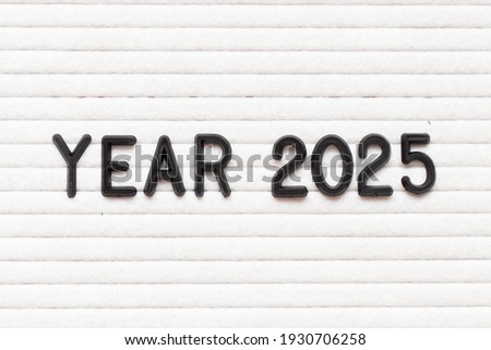 Black color letter in word year 2025 on white felt board background
