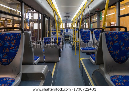 Interior of a modern trolleybus. Passenger compartment. Background Royalty-Free Stock Photo #1930722401